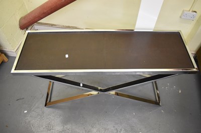 Lot 42 - A modern chrome X-frame consol table with...