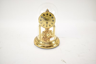 Lot 119 - A modern German brass anniversary clock under...