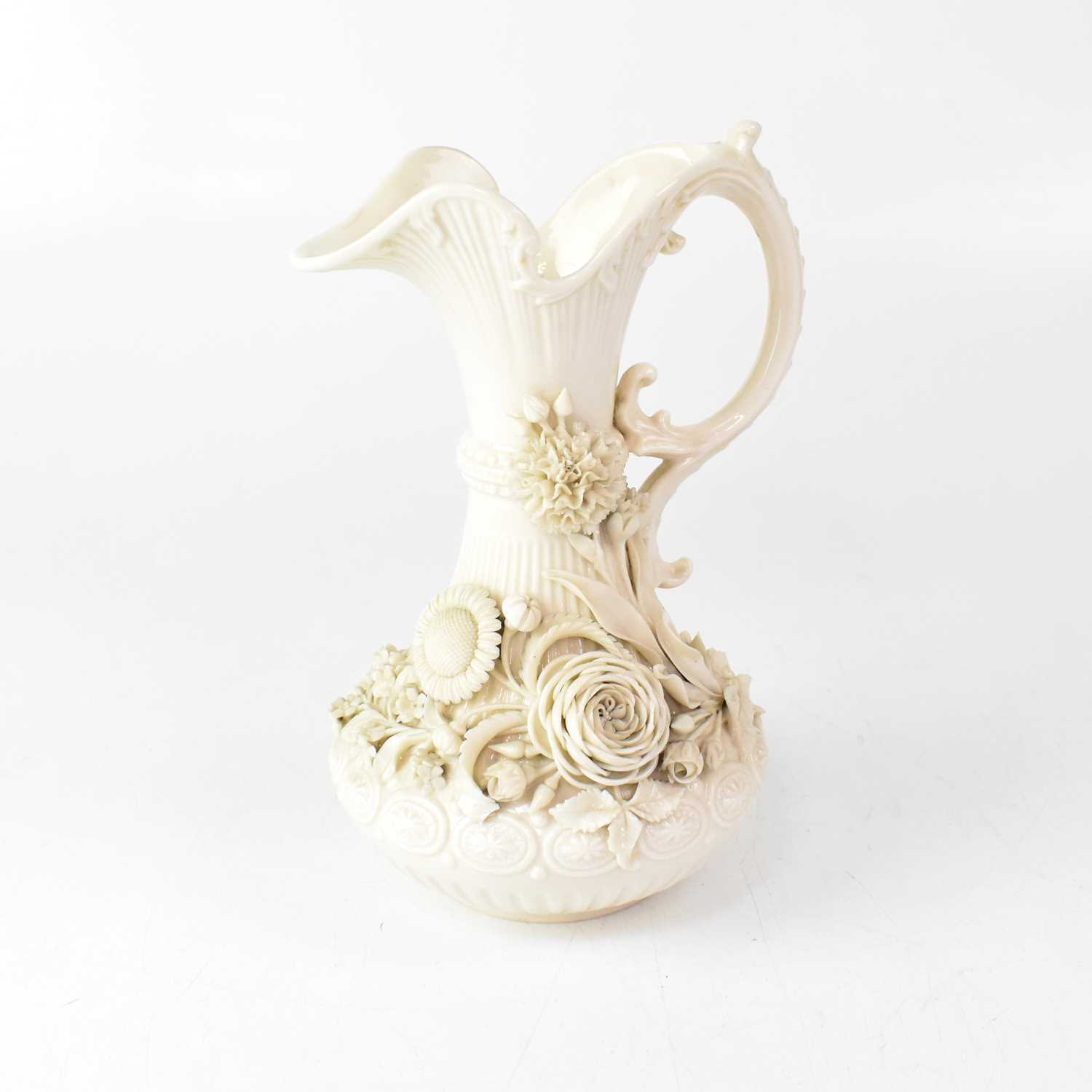 Lot 419 - BELLEEK; a blanc de Chine ewer, height approx....