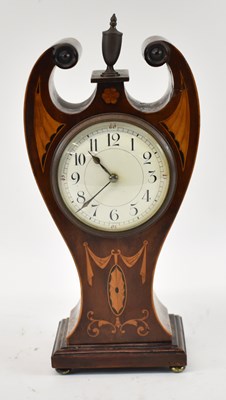 Lot 120 - An Edwardian inlaid mahogany mantel timepiece...