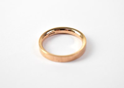 Lot 1044 - A 9ct rose gold band ring