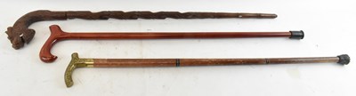 Lot 252 - A group of three walking sticks, to include a...