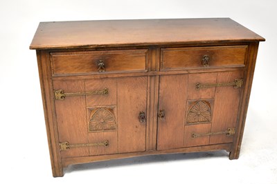 Lot 24 - An Arts & Crafts style oak sideboard