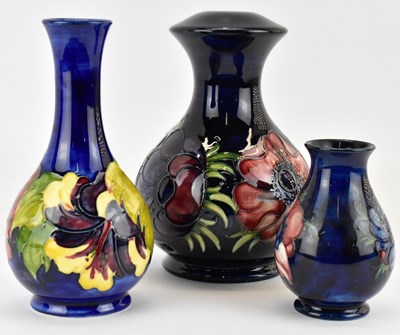 Lot 407 - MOORCROFT; three items of blue ground pottery,...