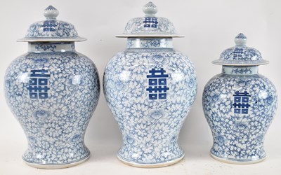 Lot 524 - A set of three Chinese blue and white baluster...