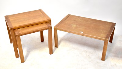 Lot 38 - A nest of three light oak tables