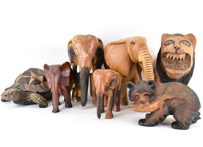 Lot 208 - Six carved wood animals, comprising four...