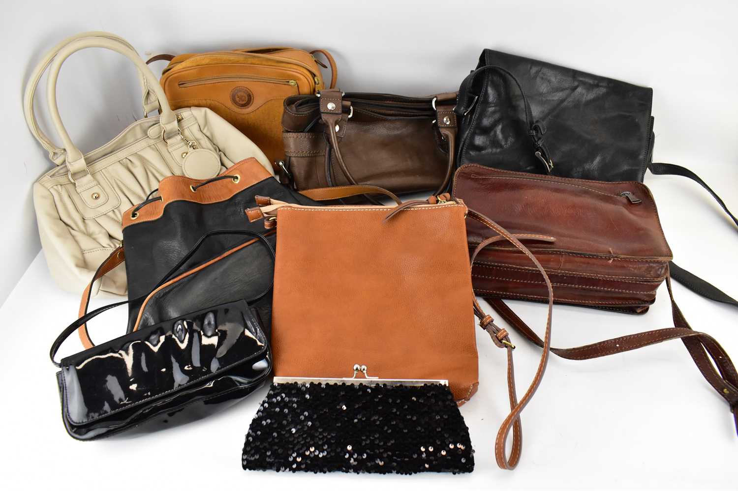 Lot 360 - Nine ladies' handbags of various colours,