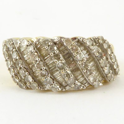 Lot 977 - A 10k gold diamond cluster ring, the table...