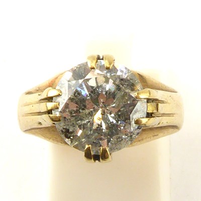 Lot 972 - A gentlemen's gold and diamond ring, the claw...