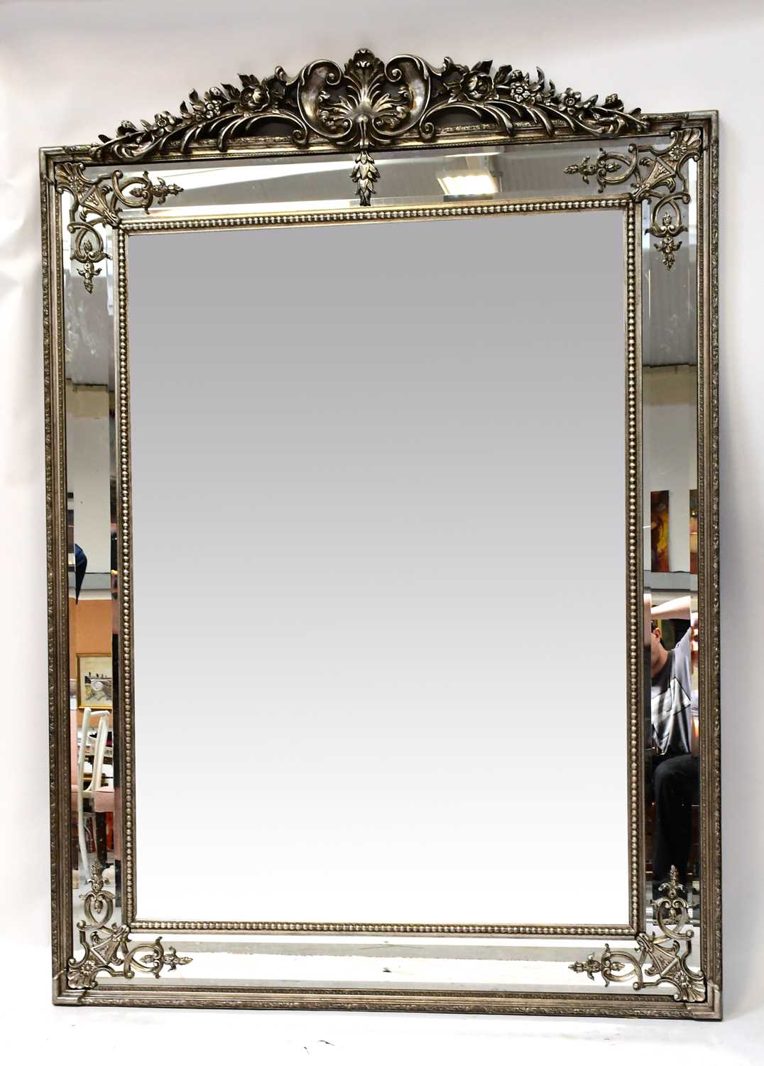 Lot 115 - A Large Modern Bevel Edged Mirror Within An