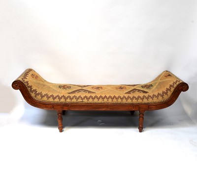 Lot 9 - A modern reproduction mahogany day bed with...