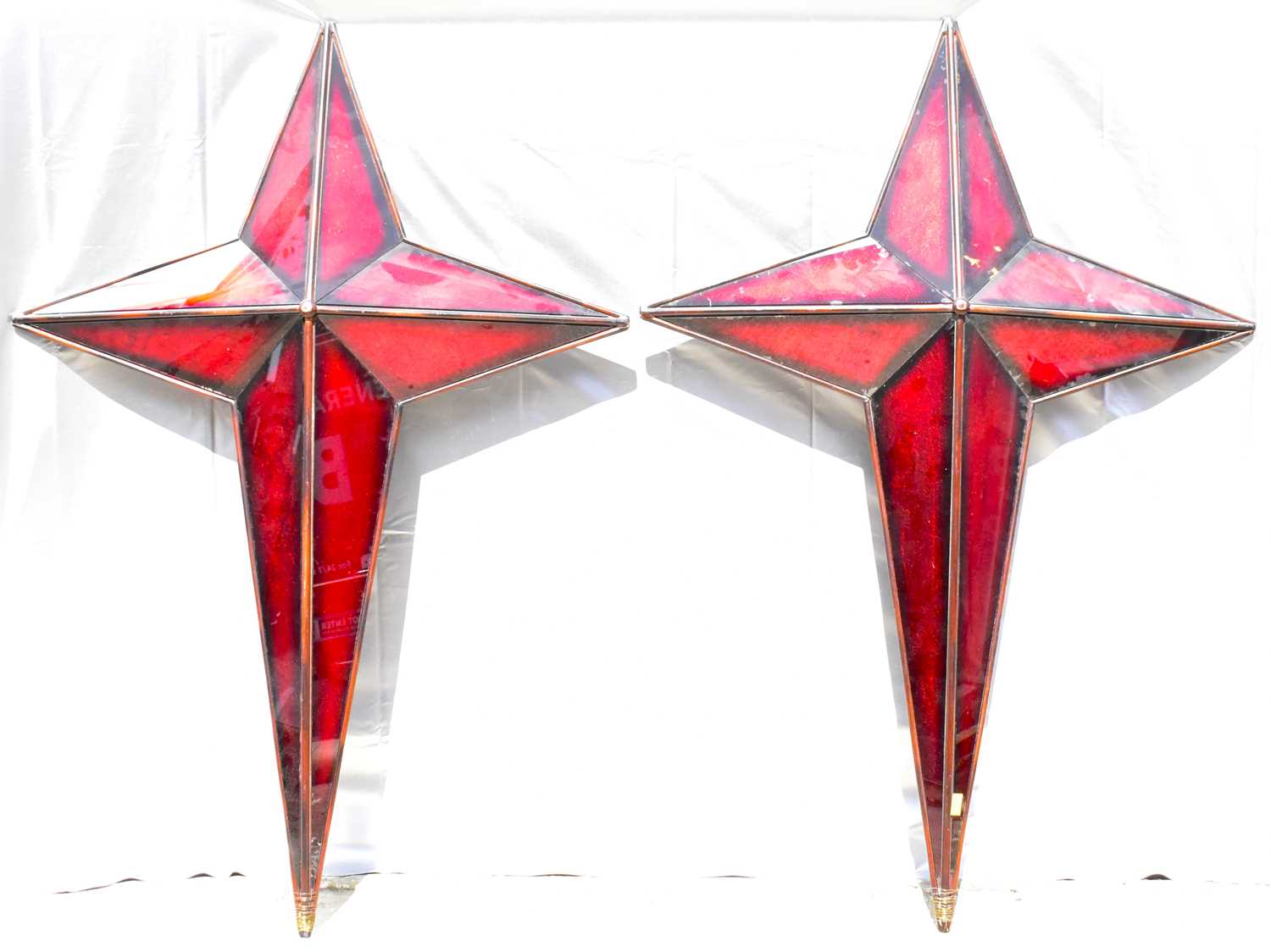 Lot 199 - A pair of large modern wall-hanging red stars...