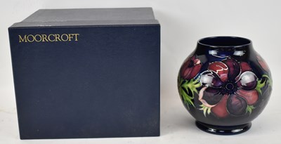 Lot 438 - MOORCROFT; a large blue ground vase decorated...