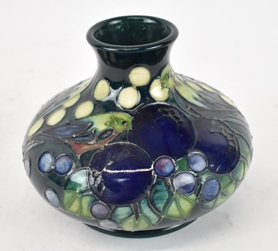 Lot 458 - MOORCROFT; a dark blue and green glazed vase...