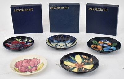 Lot 443 - MOORCROFT; a group of five pin dishes, some...