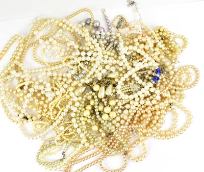 Lot 1138 - A quantity of simulated pearl necklaces,...