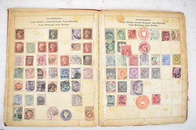 Lot 443 - Three early stamp albums and a postcard album,...