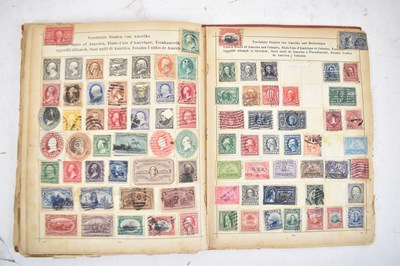 Lot 443 - Three early stamp albums and a postcard album,...