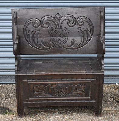 Lot 46 - An early 20th century carved oak monk's bench,...