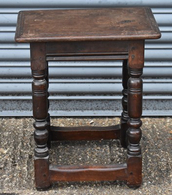 Lot 34 - An oak joint stool on turned stretchered...