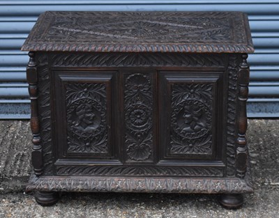 Lot 35 - A small early 20th century carved oak coffer,...