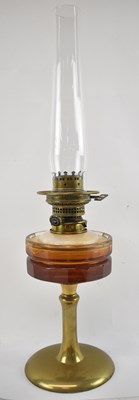 Lot 81 - An early 20th century brass oil lamp, height...