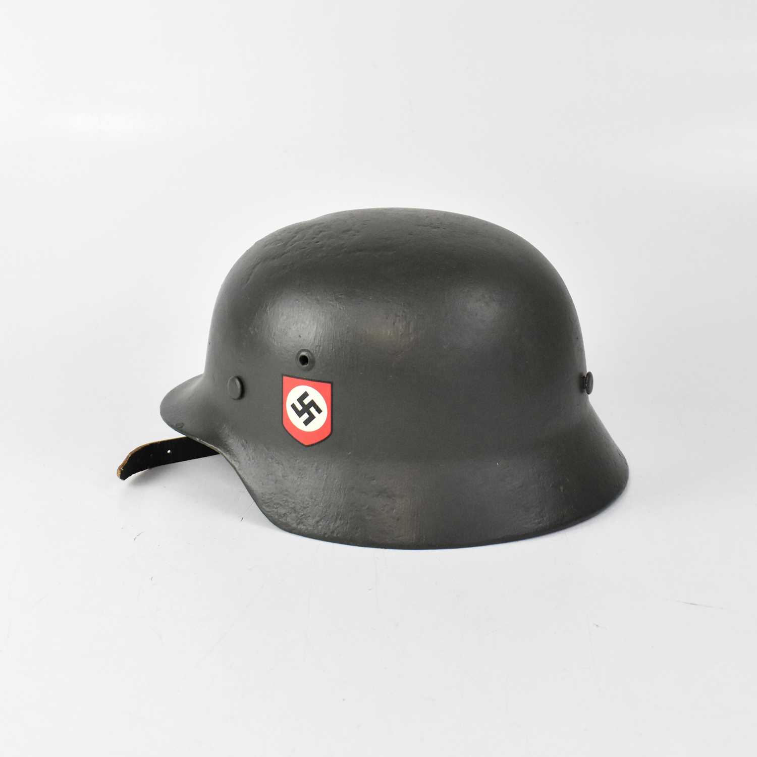 Lot 569 - A WWII period German SS helmet, with later...