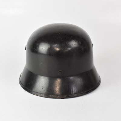 Lot 572 - A WWII period Hitler Youth helmet with tan...