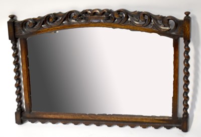 Lot 68 - An early 20th century oak framed bevel edged wall mirror