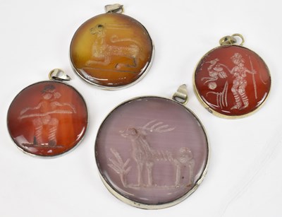 Lot 811 - Four Eastern white metal framed intaglio set...