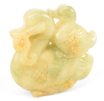 Lot 566 - A Chinese carved green hardstone figure of two...