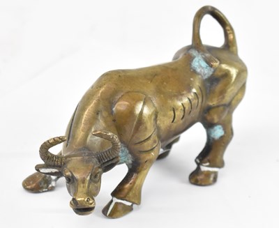 Lot 571 - A Chinese bronze figure of a bull, length 12cm.