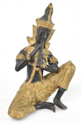 Lot 549 - A Thai bronze and gilt figure of a seated...