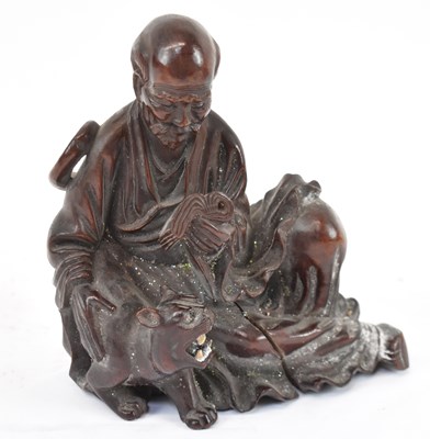 Lot 570 - A Chinese carved rootwood figure, height 17cm.