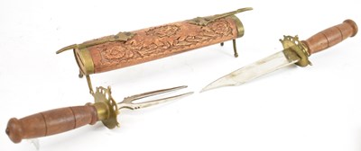 Lot 235 - An Eastern knife and fork, contained in carved...