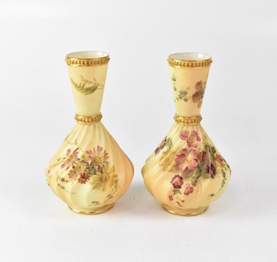 Lot 393 - ROYAL WORCESTER; a pair of gilt-heightened...