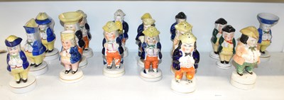 Lot 423 - A collection of nineteen Staffordshire Toby...