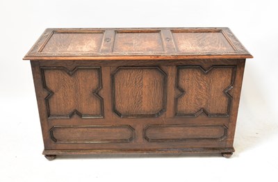 Lot 44 - An early 20th century oak triple panelled...