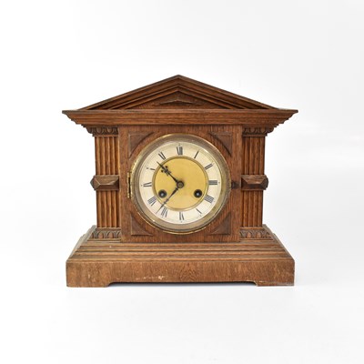 Lot 147 - An early 20th century oak cased architectural...