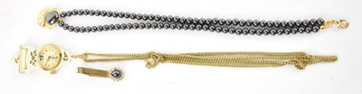 Lot 815 - A bead necklace with gold plated pendant, a...