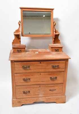 Lot 21 - A 20th century pine dressing chest with...