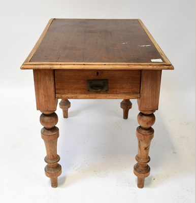 Lot 42 - An early 20th century pine table with inset...