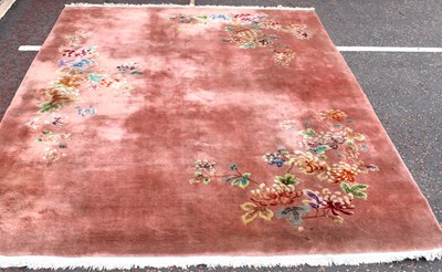 Lot 138 - A modern Chinese pink floral carpet, 375 x 274cm.