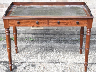 Lot 3 - A Victorian mahogany writing table with green...