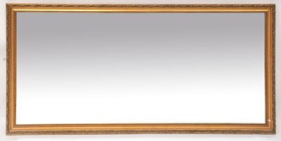 Lot 113 - A large modern gilt framed mirror, 59 x 133cm.