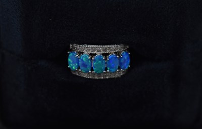 Lot 699 - A 10ct white gold ring set with coloured...