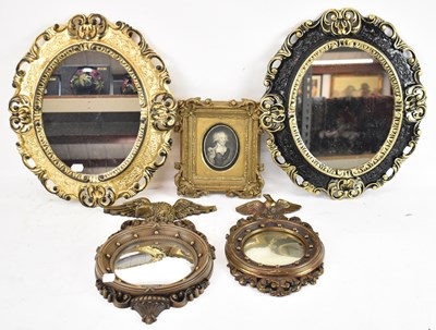 Lot 59 - A near pair of decorative black and gilt oval...