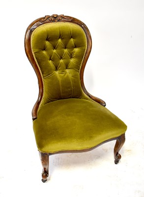 Lot 20 - A 19th century walnut button back nursing chair