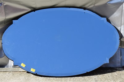 Lot 111 - An Art Deco oval bevel edged mirror with...